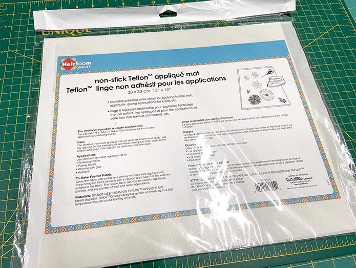  The Heirloom non-stick Teflon Applique Mat can be used for a variety of crafts involving adhesives. Mary Ellen’s Best Press, HeatnBond Lite Iron-On Adhesive Sheets, Olfa 5" Stainless Steel Serrated Edge Scissors, Heirloom Non-Stick Teflon Applique Mat, Oliso M2Pro Mini Project Iron.