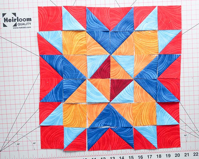  Laying out the fabric pieces according to the block’s layout diagram first will make it easier to sew the block’s pieces together. Block 7 Spectrum Quilt-A-Long 2020 quilt design featuring fabrics from the Wave Texture collection by Benartex.