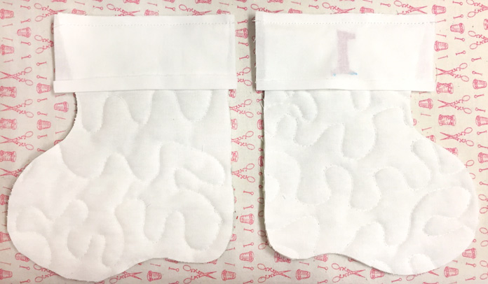 Front and back of stocking cuff sewn right side against lining and sewn ¼″ from top raw edge, Northcott ColorWorks white