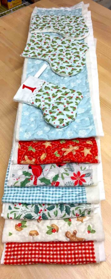 Quilt sandwiches completed and ready to make 24 mini stockings with Northcott Holiday Collections, Sugar and Spice, Swedish Christmas & Fairfield Quilter's 80/20 Quilt Batting