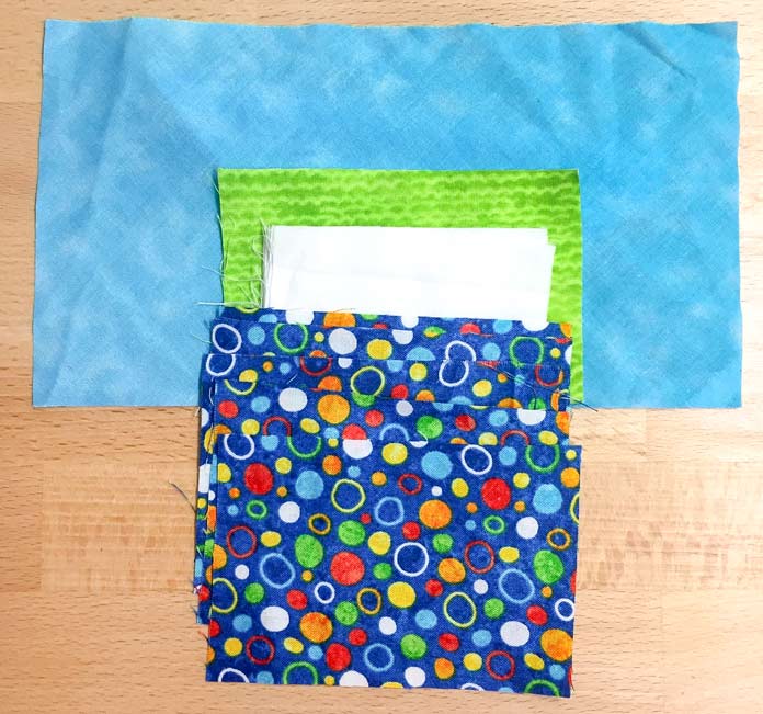Feature fabric (Blue with Dots) is from Northcott Stonehenge Kids Undersea 3D by Linda Ludovico & personal stash fabrics.