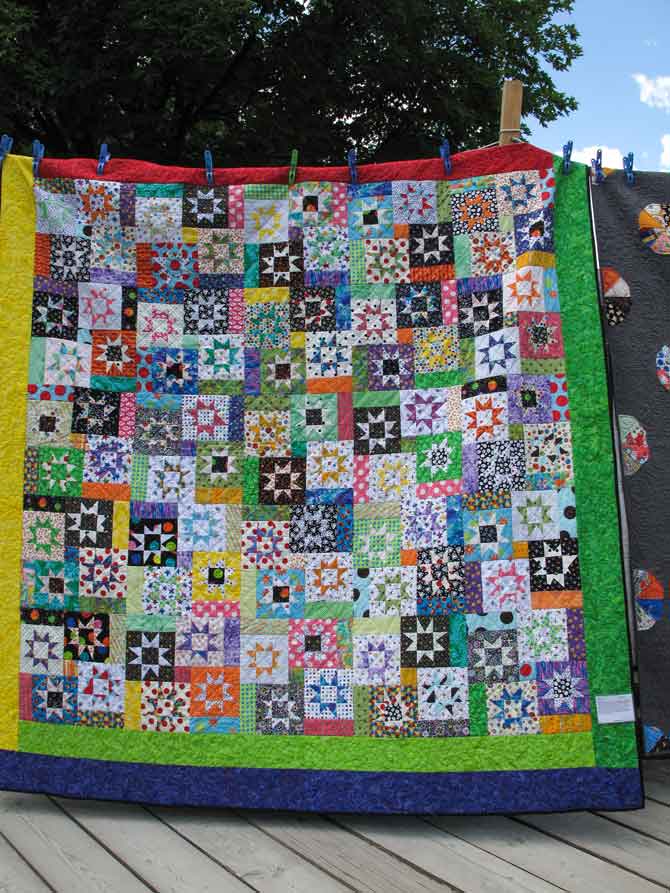 The dark and light colors in this scrappy quilt are in perfect balance.