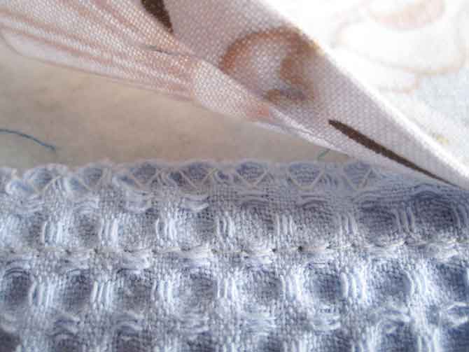 Place the pressed hem of the backing band onto the back of the waffle weave and baste into place.