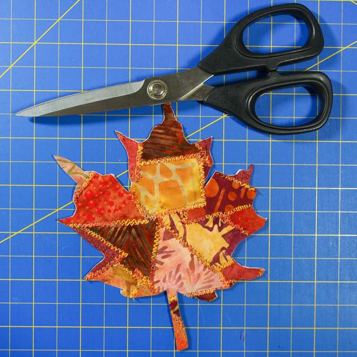 Maple leaf and sharp scissors