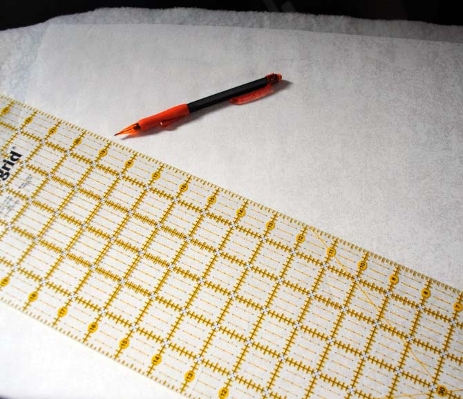 Marking the first quilting line across the pillow top