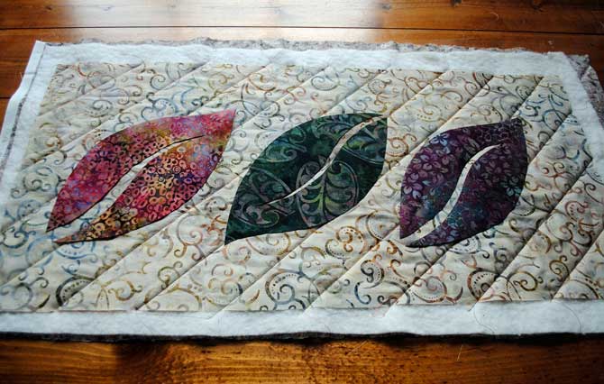 Placing the applique shapes on the quilt top