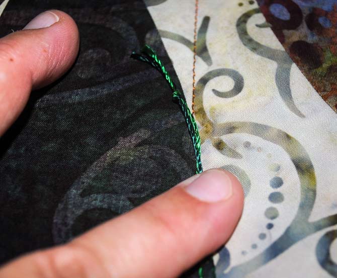 Placing the threads on the edge of the applique shape