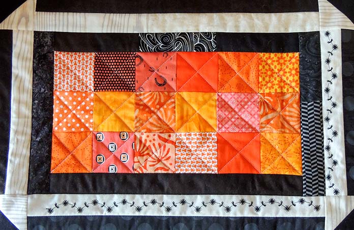 Completed fall accent pillow cover laid flat.