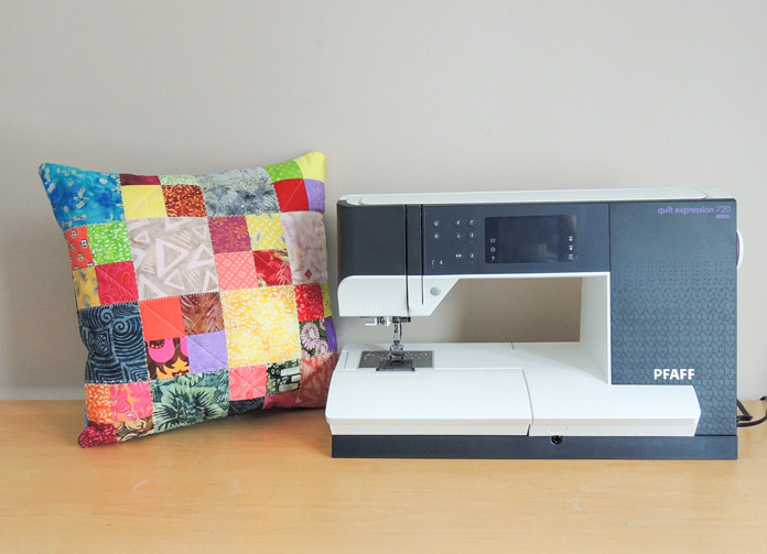 Quilted patchwork cushion and PFAFF quilt expression 720 machine.