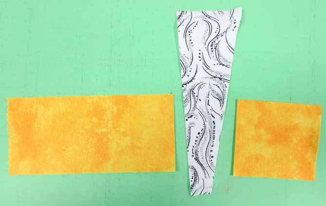 Sew a chimney strip to 2 pieces of sky fabric.