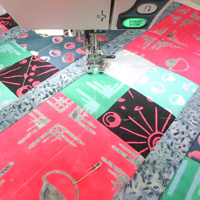 Use a walking foot for quilting.