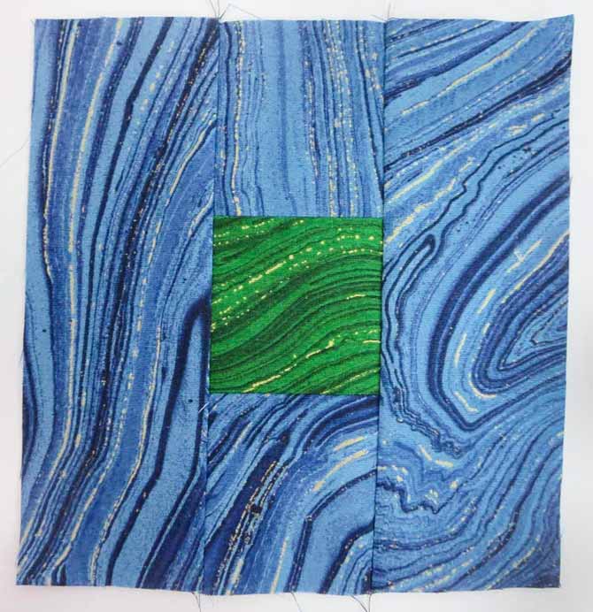 6½" x 6½" finished block using Sandscapes green in the center and Sandscapes blue on the outside of the block