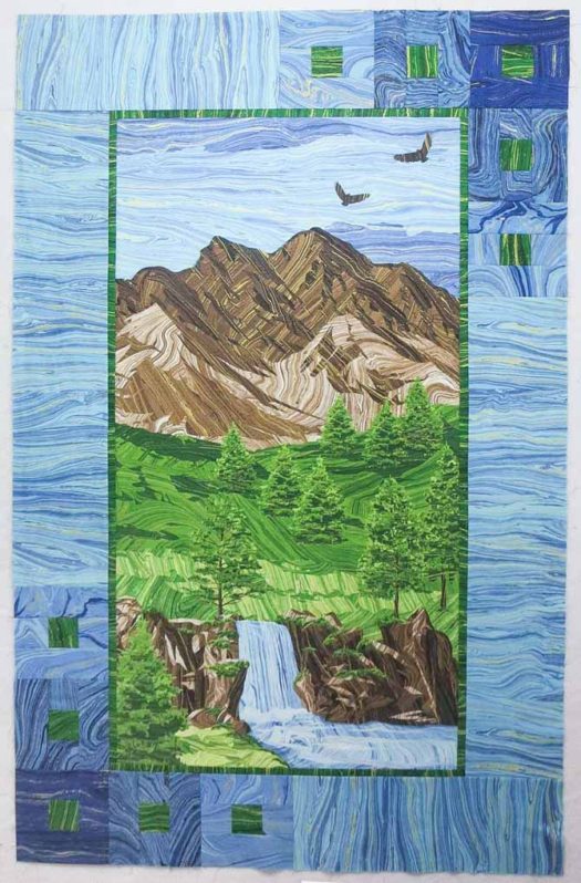 "Mountain Peak" panel quilt with pieced border using Northcott's Sandscapes fabrics. Finished size 35" x 55"