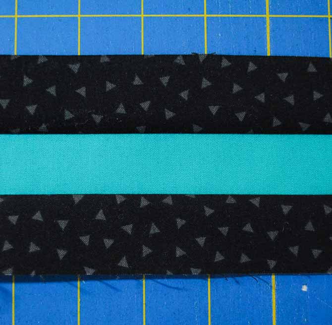 Sewing the teal and black strips together