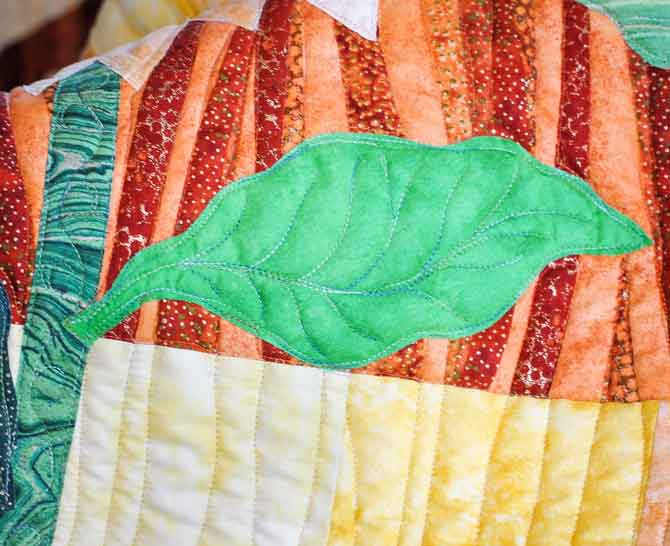 Small leaf and stem quilting design close up