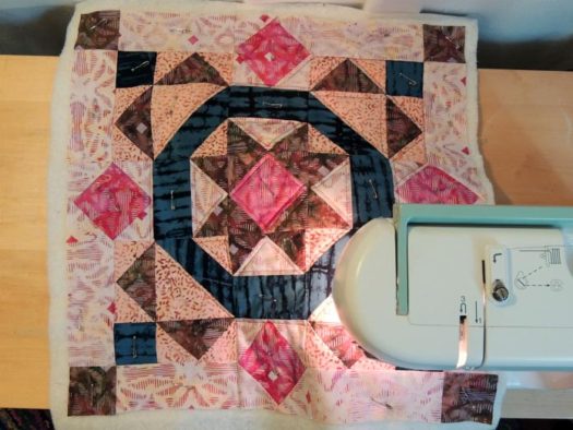 Overhead view of quilting cushion cover front.