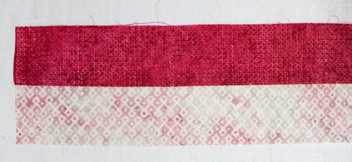 Stitch together the light D5 strip to the medium dark B4 strip. Cut to make four (4) 2½” x 4½” rectangles.