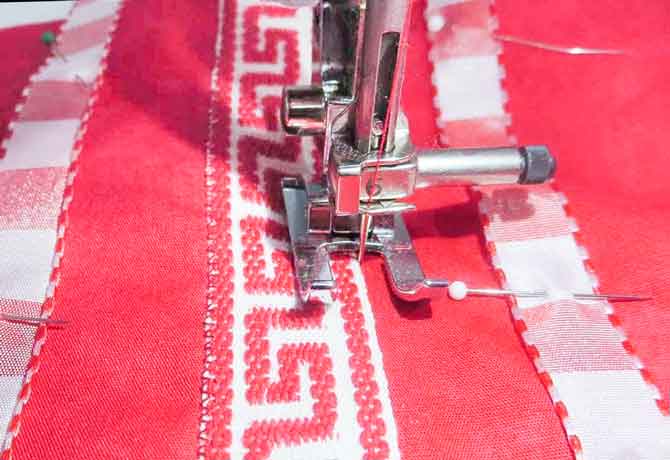 Using the open toe foot on the NQ900 to zig-zag stitch the braid in place