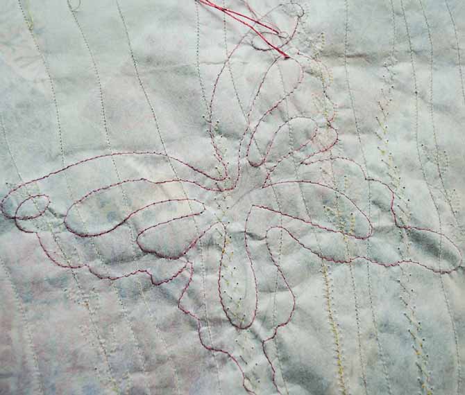 The back of the free motion sample completed with Dazzle thread from WonderFil.