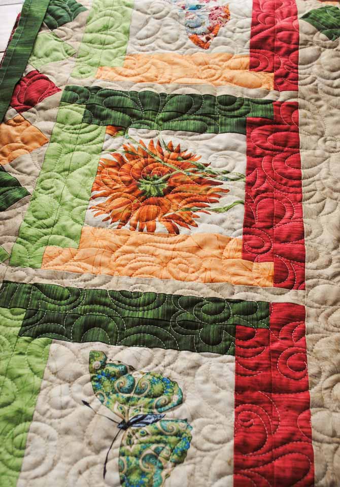 The flower design quilted on the bed runner with WonderFil's Master Quilter and DecoBob threads.