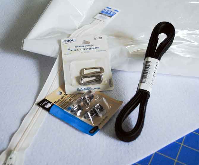 Hook and loop tape, heavy fusible interfacing, woven strapping, clear vinyl and rectangular strap rings.