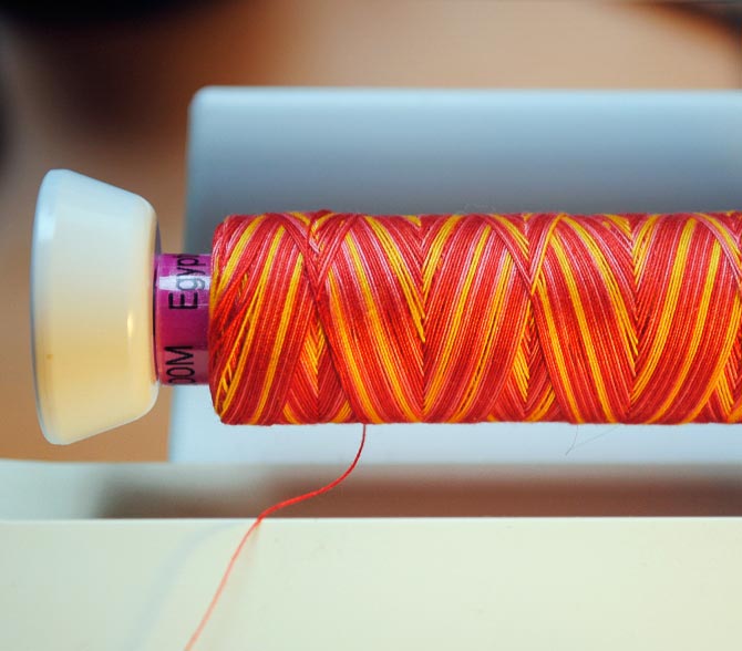 Thread on horizontal thread holder