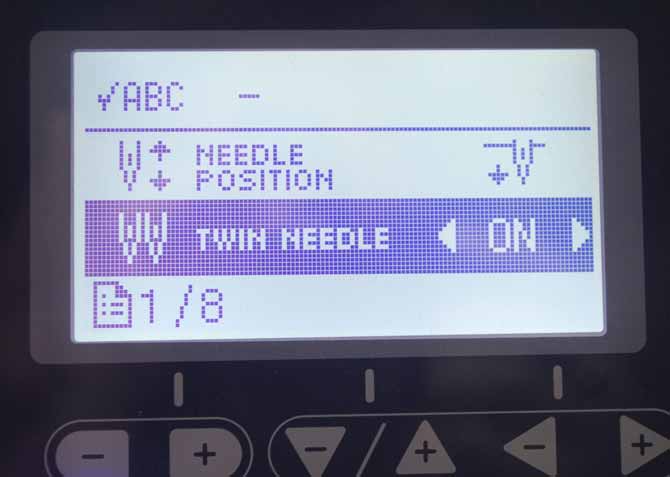 The Twin Needle setting on the NQ900 is set to "on".